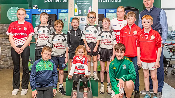 SuperValu Castletownbere has launched its fundraising return scheme and people can deposit their Re-turn voucher at the unit in store to support local organisations such as  Castletownbere GAA, Urhan GAA, Adrigole GAA, Garnish GAA, Beara ladies and Castletownbere Tidy Towns. At the launch were (back, from left): Eimear O’Shea, Conall Lowney, Luke Browne, Brian Joseph Lowney, Finnán Browne, Ashlinn Lowney, Abbie O’Shea, Danny Con O’Sullivan and Jamie O’Sullivan. Front (from left): Denis Harrington, Méabh O’Sullivan and Jack O’Sullivan.  (Photo: Anne Marie Cronin)