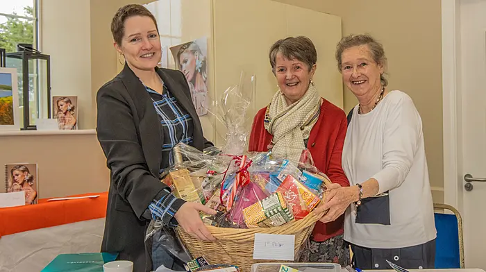 Organisers of the Darrara art group held a Christmas art and craft fair at Darrara Community Centre recently. Preparing the hamper for the raffle on the day were (from left): Deirdre Archbold, Patricia O’Brien and Mary O’Brien.(Photo: Gearoid Holland)