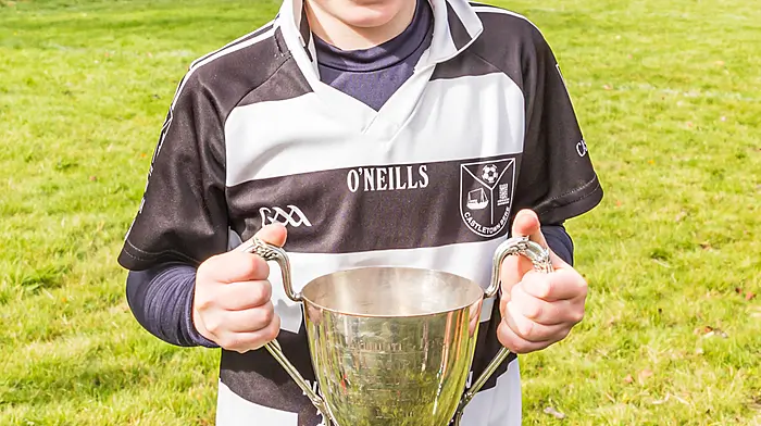 Danny O’Shea smiling broadly as he lifted the U10s cup. (Photo: Anne Marie Cronin)