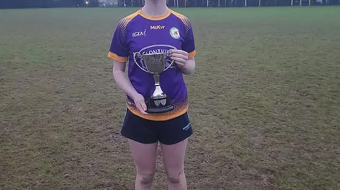 Karen Dukelow (Durrus) with the cup after her team won the GAA ladies divisional final last weekend.