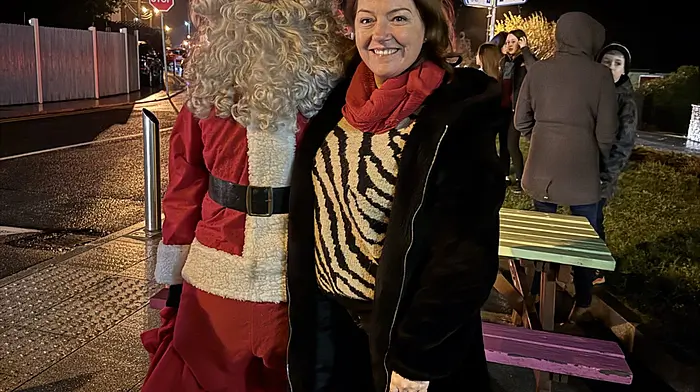 Cllr Caroline Cronin, who was instrumental in ensuring that Durrus represented County Cork in the Pride of Place competition, seen with Santa at the lighting of the village Christmas tree last Saturday night.