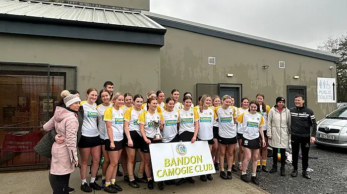 Bandon camogie club’s minor team with their coaches and mentors after winning the minor C championship final against Banteer last Saturday at the Cork camogie grounds, Castle Road, Cork. The team was captained by Alice Lillis.