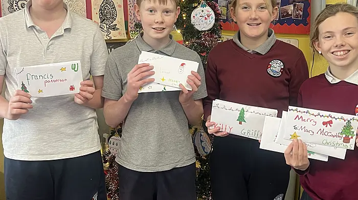 Rath NS students with their letters to elderly people