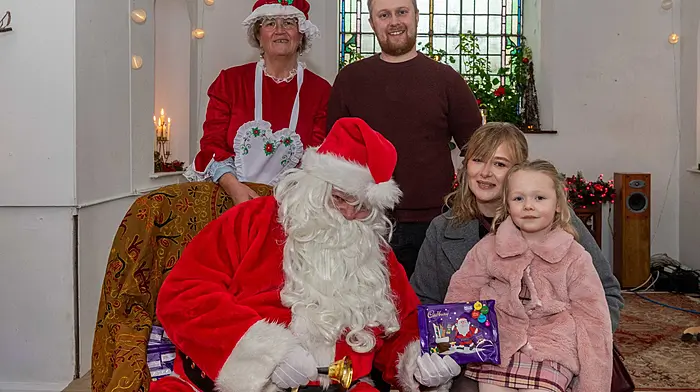 Kevin Lynch, Stephanie Coleman and Allie Lynch from Bantry meeting Santa when he visited the town last Sunday and gave out selection boxes to all the children. The event was organised by the Banty Business Association. (Photo: Andy Gibson)