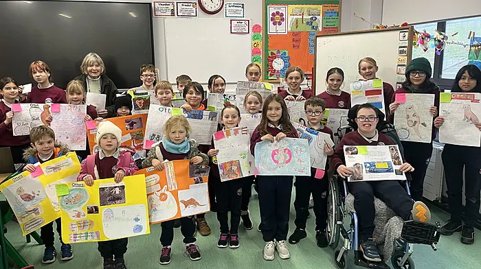 Rath National School winners in the Baltimore Tidy Towns competition about otters with Coreen Martin (Baltimore Tidy Towns) were Feride Seitmemetova, Emiliia Kravchenko, Joni Perry Clark, Desiree Koorn, Theo Best, Darragh Murphy, Darragh Fitzgerald, Mark Marchenko, Hannah Sheehy, Edie Reilly, Caoimhe Cottrell, Alexis O’Regan, Ciara Cottrell, Clara Hickey and Afiqah Binti Rosihidin. Front (from left): Sean Holland, Annie Casey, Ella MacAuley, Muireann Daly, Sadie Kiely, Leah Sadikovic, Eoghan Collins and James Hurley.