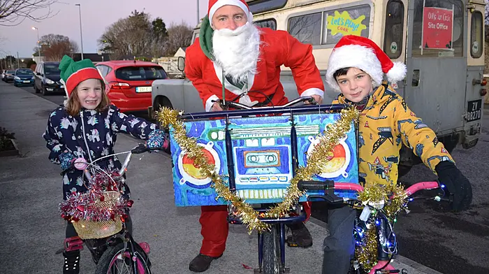 Martin, Hannah and Oisin O'Donoghue spread some Christmas cheer when they took part in the Santa Cycle through Skibbereen.  (Photo: Anne Minihane)
