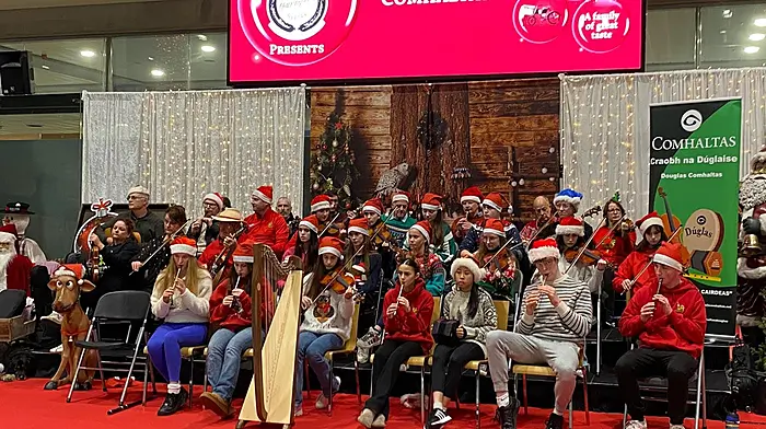 Comhaltas na Dúglaise Grúpaí Cheoil playing at Cork Airport and welcoming people home to Cork.