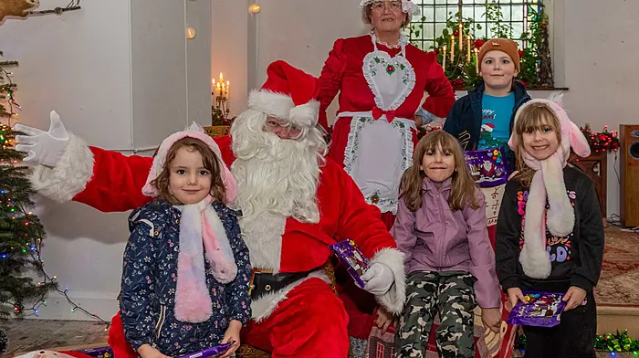 Nevaeh, Ivy, Riley and Karlyle Such from Kealkil visiting Santa and Mrs Claus at a recent event in Bantry which was organised by the Bantry Business Association. (Photo: Andy Gibson)