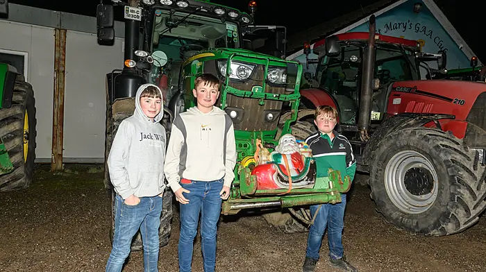 Liam Healy (Lisavaird) with brothers Daniel and Conor Walsh (Ballinascarthy) at the Kilmeen Macra Christmas lights tractor run which started at Tots Pub, Ballygurteen Cross and finished in Enniskeane. The proceeds of the run are in aid of the Irish Cancer Society and Marymount Hospice.  (Photo: David Patterson)