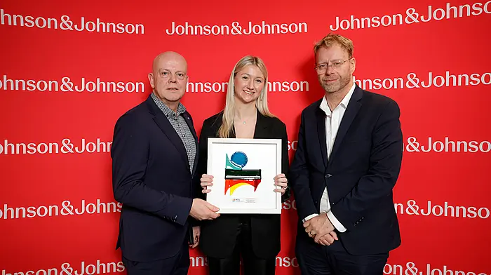 Niall Morris (head of department, mechanical, biomedical and manufacturing engineering, MTU) and Jonathan Sowerbutts (plant leader, Johnson & Johnson Medtech) with Abigail Blakeman, a MTU student at Thomond Park, Limerick to mark her receipt of a scholarship from global healthcare company, Johnson & Johnson, as part of its WiSTEM2D Programme. (Photo: Conor McCabe)