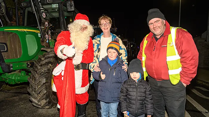Santa with Eilish and Conor Timoney and Tommy and Kevin Collins (all Ahiohill) enjoying their evening at the Ahiohill Christmas lights tractor run. Proceeds from the tractor run will go to West Cork Rapid Response. (Photo: David Patterson)
