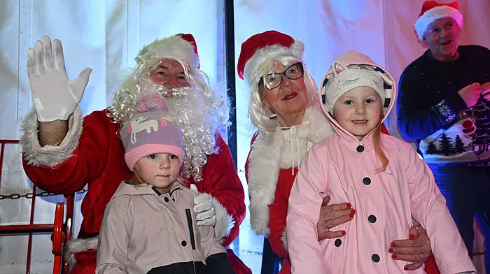 Zara and Amelia Donelan Sheehy, Skibbereen with Santa and Mrs Claus at the switching on of the Christmas lights in Skibbereen. (Photo: Anne Minihane)