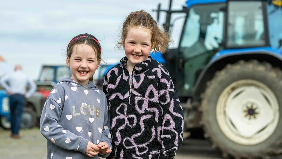 Sisters Róisín & Eada McCarthy, Ballinacarriga were all smiles at a charity tractor, car and lorry run held in aid of Cancer Connect, Randall Og GAA Club and Ballinacarriga National School (Photo: Andy Gibson)