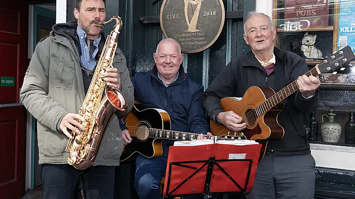 Mark van Dam, Castlefreke, Ger Deasy, Galley Head and Pat Mannion, Rosscarbery raising funds for Daffodil Day outside De Barras's in Clonakilty. Right: Geri Ho, Bandon supporting Daffodil Day in Clonakilty. (Photos: Martin Walsh.)