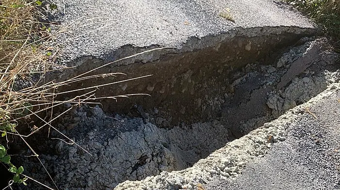 Broken bridge means locals are taking the long road home Image