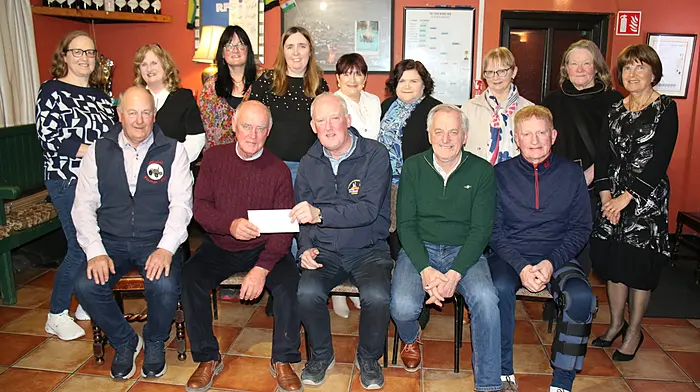 At the Ahiohill Vintage Club’s cheque presentation to the Courtmacsherry RNLI were (back, from left): Áine Hales, Veronica McCarthy, Violet Kelly, Denise Lane, Christine O'Sullivan, Linda Ryan, Elma O'Neill, Ann Dawson and Elizabeth Helen. Front (from left): Jimmy O'Sullivan, JJ McCarthy, Liam Murphy (Courtmacsherry RNLI), Walter Helen and Vincent O'Donovan (Courtmacsherry RNLI).