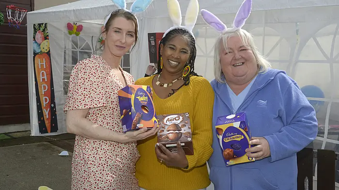 Emma Keane, Nasipho Maiyiki, and Kim Belcher having fun at the Easter egg hunt in Bandon. (Photo: Denis Boyle)