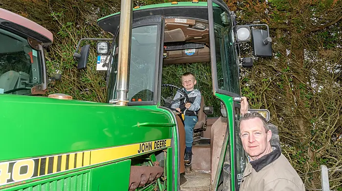 Frankie (5) and Sean Collins from Skibbereen checking out a John Deere 3040 tractor at the Lisavaird Rosemary Calnan memorial tractor, truck and car run. The proceeds will go to Cancer Connect and Lisavaird National School.  (Photo: David Patterson)