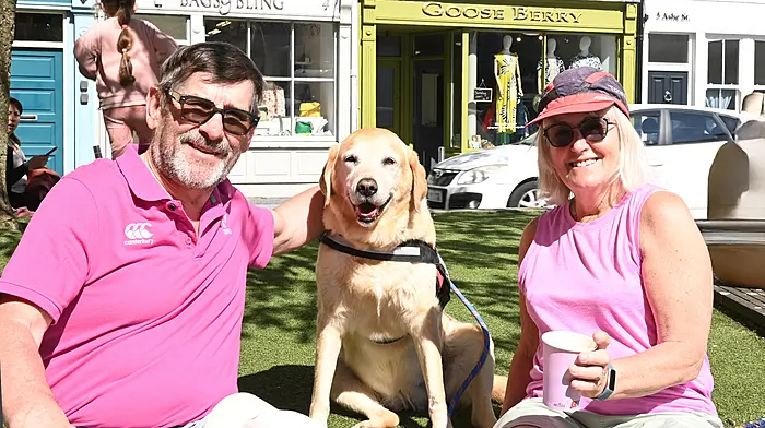 Locals Alfie and Ann Acheson and their dog Jess sitting in the sunshine in Astna Square, Clonakilty. Photo: Martin Walsh.