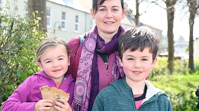 Newly resident in Ring, Áine Power with her children Érin and River on a trip to the Friday market in Clonakilty. Photo: Martin Walsh.