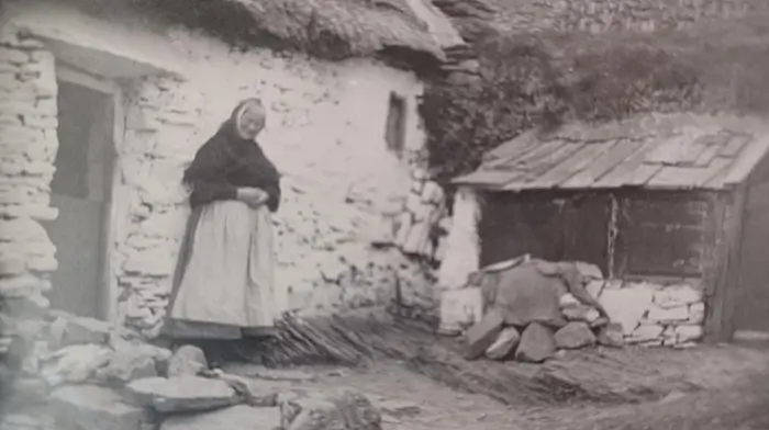 Joanna Murray stands at her homestead near Old Head in 1898.