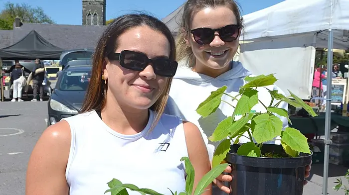 Emma and Shelley Daly, Castlehaven enjoying the gorgeous sunshine at Skibbereen's Farmers Market last Saturday. Photo; Anne Minihane.