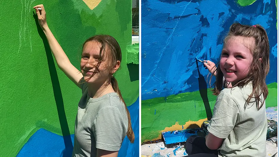 Small school, big mural,  big smiles, bigger hearts Image