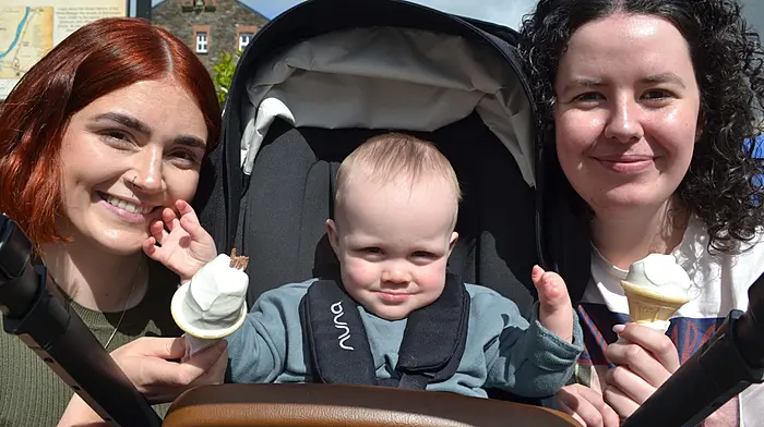 Enjoying the sunshine in Skibbereen last Saturday morning were Grainne O'Driscoll and Odhran O'Regan from Skibbereen and Laura O'Driscoll, Bantry. Photo; Anne Minihane.