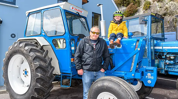 The run was in aid of Bru Columbanus. Sean O'Donovan and Eddie Williamson (5) from Leap were enjoying the sunshine. Right: Evan Collins (2) from Clonakilty, checking out a Massey Ferguson 35. (Photos: David Patterson)