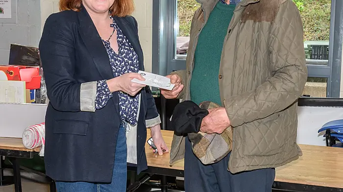 Principal Niamh McShane presenting Jerry O’Neill (Ballinadee) with his raffle prize at the Bandon Grammar School and Bandon Union of Parishes tractor, truck and car run which was held in aid of St Michael's Centre in Bandon and St Fintan's development fund.  (Photo: David Patterson)