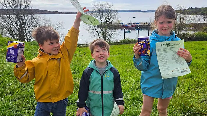 caption XXX Finn, Eoin and Olivia Twomey delighted with their Easter treasures at the Schull Easter Treasure Hunt finish line