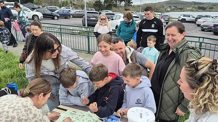 Keen egg hunters queue for clues and maps as Padraig McCarthy, Timmy Cleary, Cormac McCarthy and Kayla Cleary sign in for the  the Schull Easter Treasure Hunt organised by Schull Regatta Committee.
