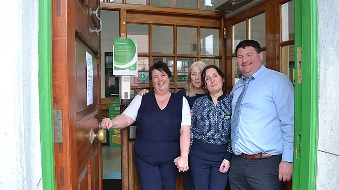 Staff members Karen McDermott, Caroline Collins, Trish O'Mahony and postmaster David Jennings at the door of the Skibbereen Post Office before it relocated to its new premises at Drinagh Euro Spar, further along Market Street in Skibbereen. (Photo: Anne Minihane)