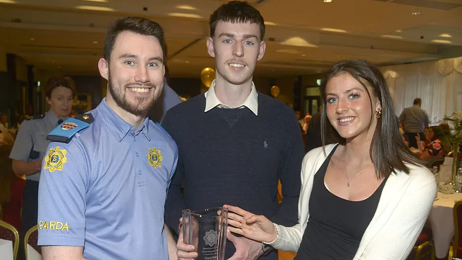 Pictured at the annual West Cork Garda youth awards at the Westlodge hotel Bantry was Naoise Quinn and Ailíse O'Sullivan community award winners, Skibbereen with Grada Aaron Brady. Picture Denis Boyle