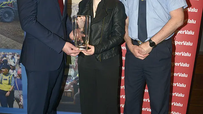 Cora Harrington Ballinadee District award winner with Eoghan Scally Supervalu and Insp Emmet Daly. Picture Denis Boyle