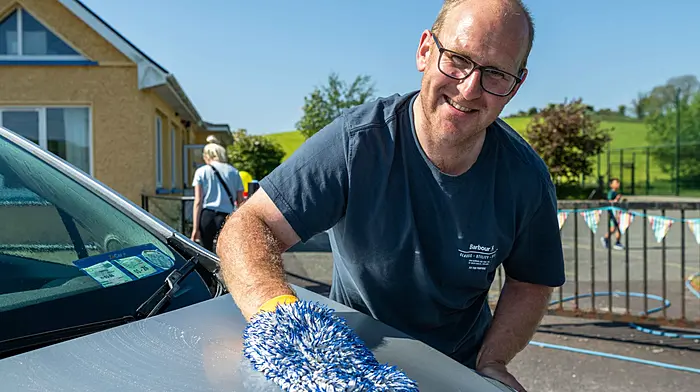 Skibbereen, West Cork, Ireland. 10th May, 2025. The warm weather continues in West Cork. Abbeystrewry National School held a charity car wash today, raising money for school funds. Volunteering his services for the day was Andrew Sweetnam from Skibbereen. Picture: Andy Gibson.