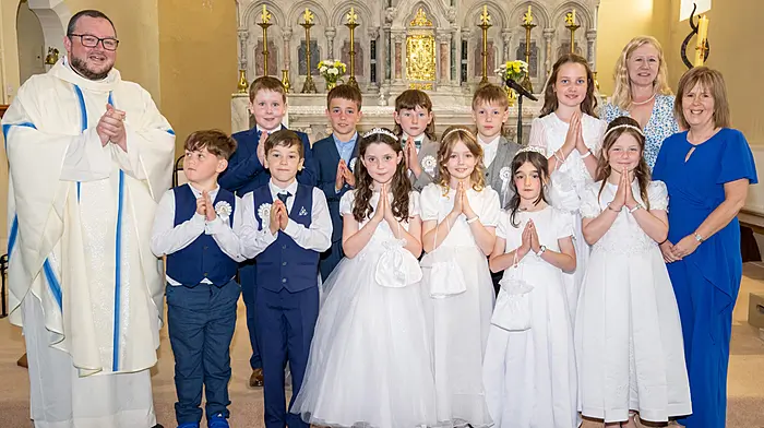 Pupils of Carrigboy NS received their First Holy Communion at the Sacred Heart Church in Durrus last Sunday. Back: Fr Ben Hodnett, Eoghan Ward, Stephen O'Keeffe, Peadar Williamson, Oisín McNulty, Sadie Ward, Ms Elizabeth Mee and  Ms Carina Hurley. Front: Kristian Levis Alford, Alex Coughlan, Caoimhe Deacy, Clodagh McCarthy, Hanna O'Driscoll and Tiah Carroll O'Driscoll.  Photo courtesy of Donal O'Connell.