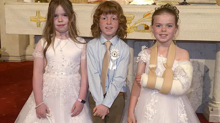 Kilcolman NS pupils Jane Moyles, Michael Tanner and McKenna Thorne celebrating their First Holy Communion.  (Photo: Denis Boyle)