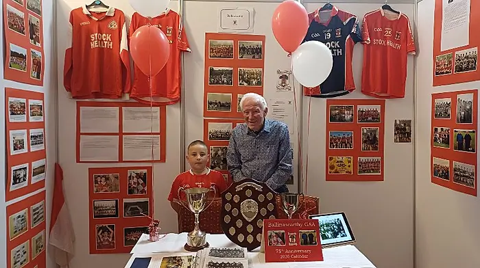GAA club president Dan Murphy with Seán O'Flynn at the Ballinascarthy stand in the Parkway Hotel, Dunmanway at the recent Carbery GAA centenary celebrations.