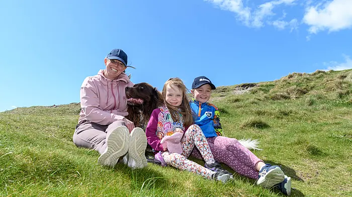 Michelle, Eva and Isabelle Mockler from Reenascreena with Diesel the dog, enjoying their day in the sun at the Long Strand tractor, truck and car run which started at The Fish Basket, Castlefreke. The run was held in aid of Cancer Connect and the West Cork Jesters.  (Photo: David Patterson)