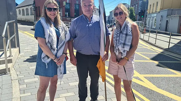 Aoife Long, Donnchadh Ó Seaghdha and Sinead Barry showing solidarity with Palestine at the Skibbereen weekly march. The march takes place every Saturday at 12.30pm to highlight the ongoing suffering of the Palestinians.