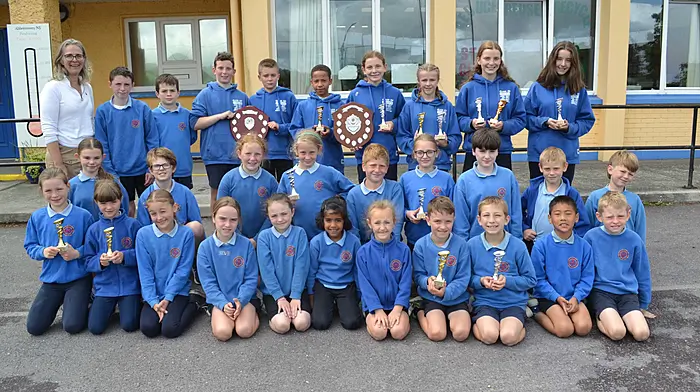 Skibbereen's Abbeystrewry National School pupils were delighted to bring home lots of trophies from the Cork City Sports primary school athletics event. The team was the overall winner of their group. Included in the photo is their principal, Jean Fuller.  (Photo: Anne Minihane)