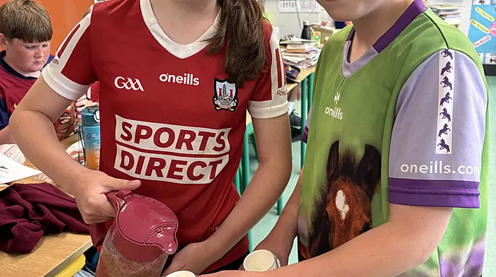 Sophie Connolly and Ellen Collins at Rath National School with one of the winning smoothie recipes made at the end of Active Week.