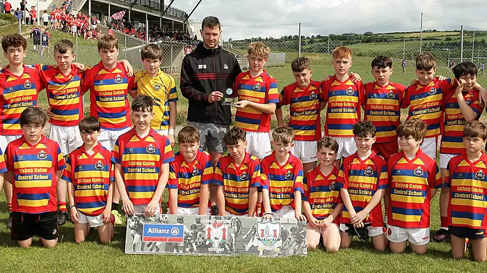 Roinn 1 Boys runners-up Bishop Gavin Central School Newcestown with Cork footballer Maurice Shanley. (Photo: Paddy Feen)