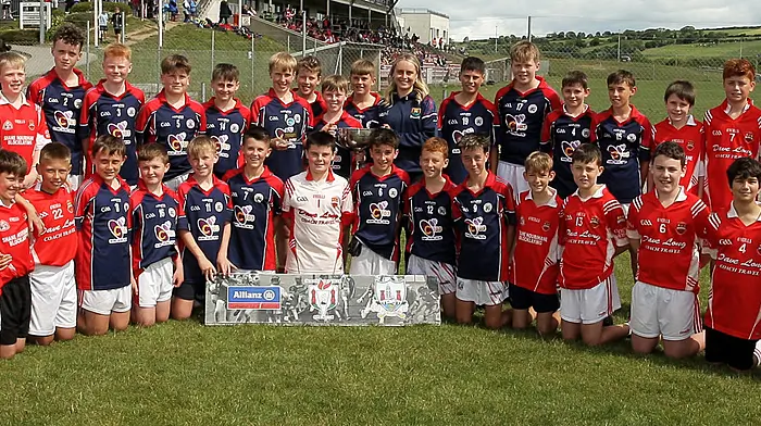 Roinn 1 Boys winners St Patrick's Boys NS Skibbereen receive the trophy from Cork footballer Laura O'Mahony.(Photos: Paddy Feen)