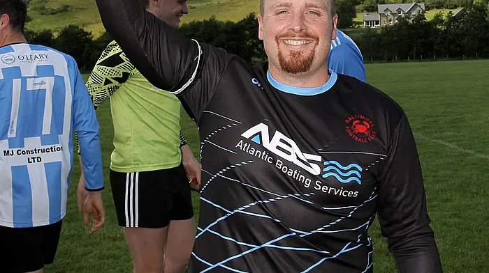 Kieran Lynch captain of the Baltimore FC team raises the O'Brien Water Services.com Championship Cup. (Photo: Paddy Feen)