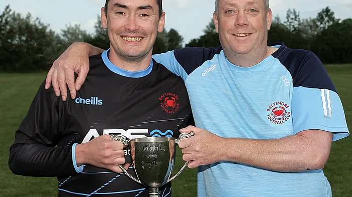 Denis and Sean McCarthy with the cup. (Photo: Paddy Feen)