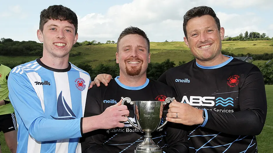 Baltimore FC's Barry Collins, captain Kieran Lynch, and Dan MacEoin with the O'Brien Water Services West Cork League Championship title that presented to the club at the Baltimore Road. (Photo: Paddy Feen)