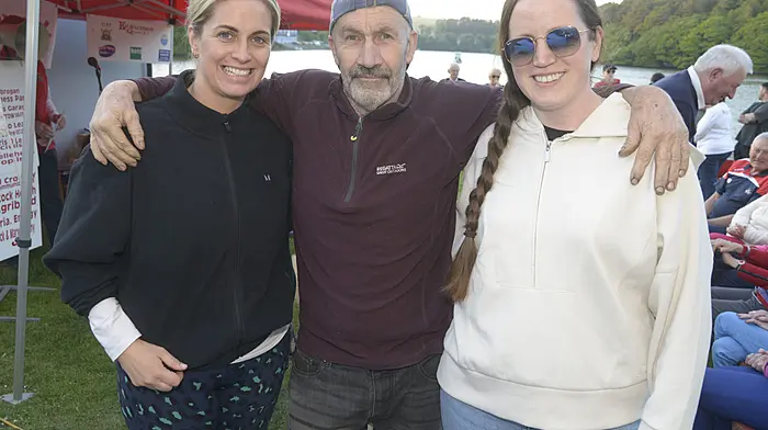 NEWS Pictured at the blessing of the new boat at Killmacsimon Quay rowing club was Bill Bennett with Aisling Dwyer and Ema Hanley. Pcture Denis Boyle