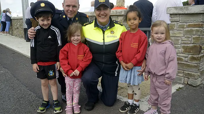 At the official re-opening of Coachford Garda Station were Coachford Community Pre-School children Finn Healy, Lauren McCarthy, Aida O'Connell and Kayla Sheahan with Inspector Paul Crowley and Sgt Liz O'Sullivan. (Photo: Denis Boyle)